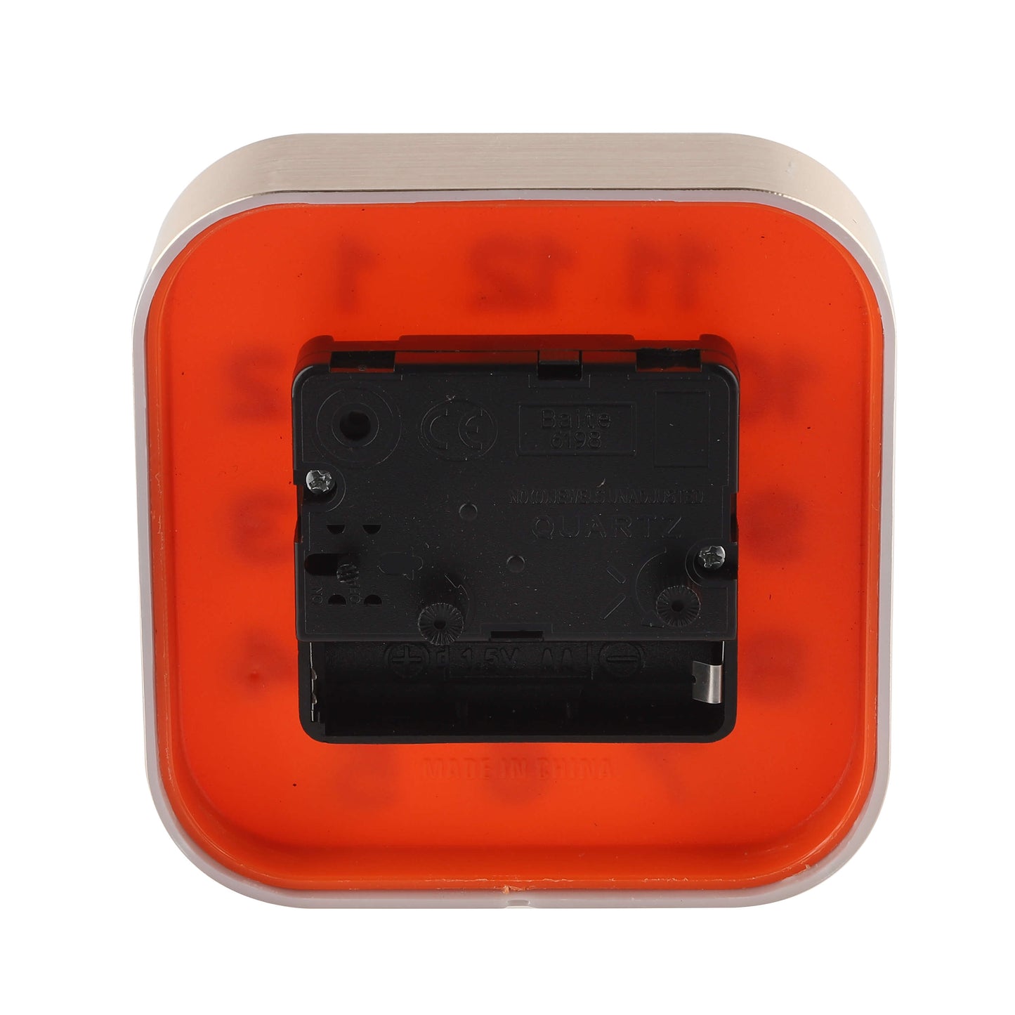 Rear view of red square alarm clock showing battery compartment and setting knobs