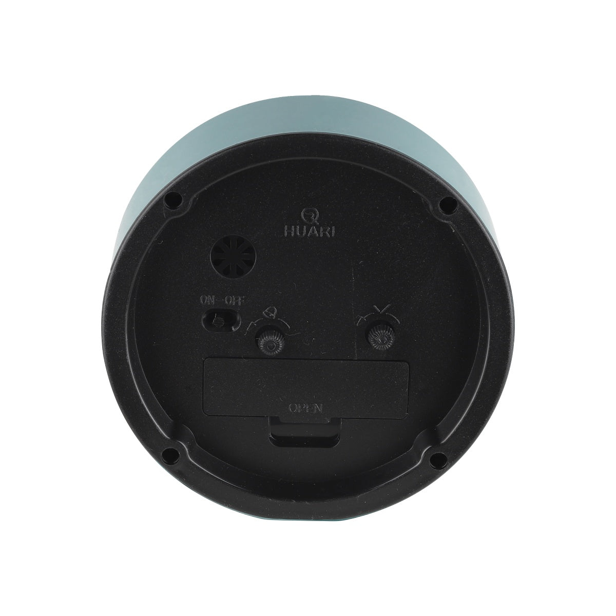 Rear of round alarm clock showing battery compartment and control knobs.